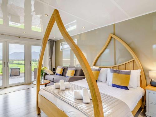 a bedroom with two beds and a balcony at 1 Bed in Keswick oc-82476 in Bassenthwaite