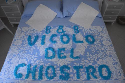 Ένα ή περισσότερα κρεβάτια σε δωμάτιο στο B&B Vicolo del Chiostro