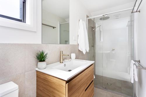 a bathroom with a sink and a shower at Tweed Holiday Parks Pottsville North in Pottsville
