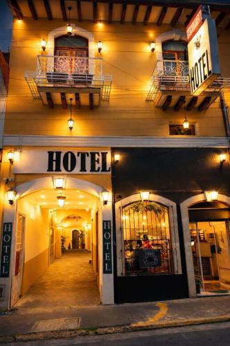 a hotel is lit up at night at Hotel Real de Juarez in Xalapa