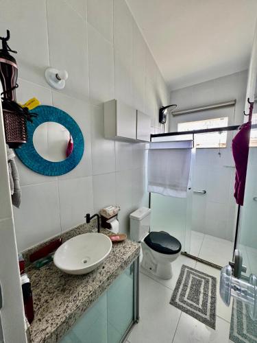 a bathroom with a sink and a toilet at Studio 12 in Santa Cruz Cabrália