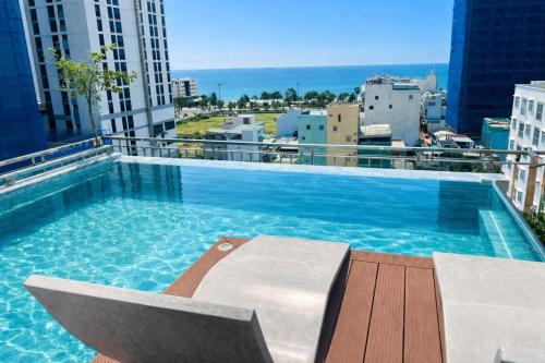 a large swimming pool on top of a building at Luu Ngai Condotel Quy Nhon in Quy Nhon