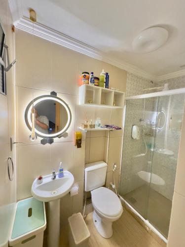 a bathroom with a toilet and a sink and a shower at 4 quartos na Folia de Olinda in Olinda