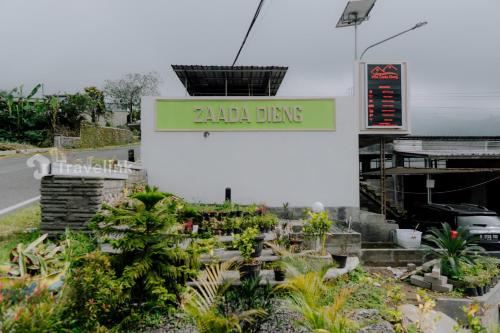 a sign that reads zilla dave in a garden at Zaada Villa Dieng Syariah By Travelink in Kejajar