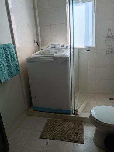 a small bathroom with a shower and a toilet at Roma Sur Comodo departamento completo in Mexico City