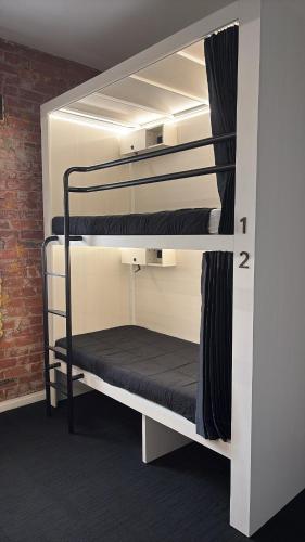 a couple of bunk beds in a room at Bayside House in Melbourne