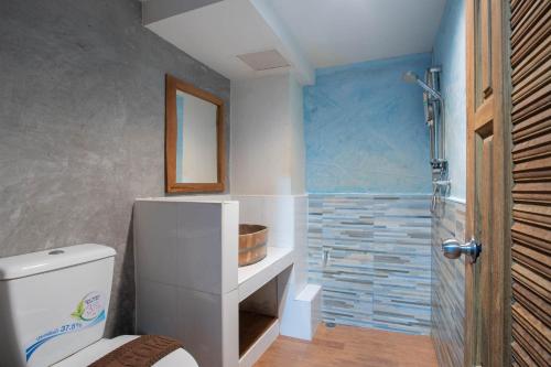 a bathroom with a toilet and a shower at P1 House Phitsanulok in Phitsanulok