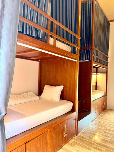 a couple of bunk beds in a room at Forest Sunset hostel in Ninh Binh