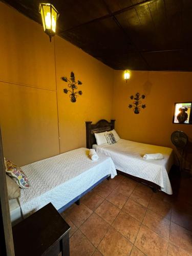 En eller flere senge i et værelse på Casa Nikte