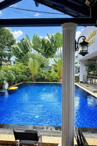 a view of a swimming pool from the patio of a resort at Window 2 Hotel in Kon Tum