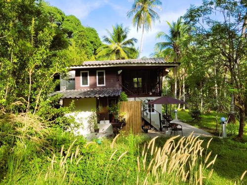 a small house in the middle of a forest at LowKey Villa - Quiet Jungle Beach Escape in Ko Kood
