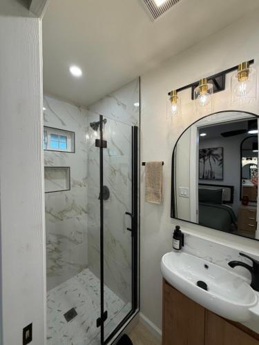 a bathroom with a shower and a sink at Beach Paradise- 4 Min Walk To Beach in Santa Cruz