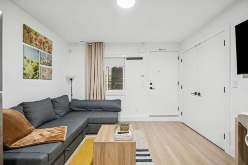 a living room with a couch and a table at NEST- Modern 2BR Basement Retreat in South Surrey in Surrey