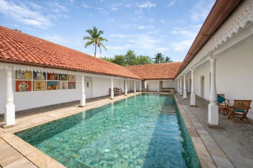 an image of a swimming pool in a house at Indigaslanda Walawwa in Bopitiya
