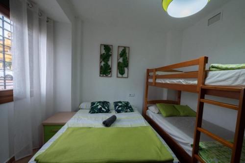 a small room with two bunk beds at Costa Esuri in Ayamonte