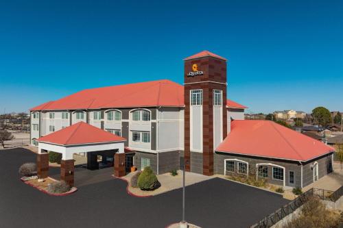 a rendering of a building with a clock tower at La Quinta by Wyndham Hobbs in Hobbs