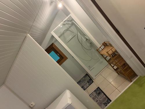 an overhead view of a bathroom with a tub at Le Chalet in Les Costes-Gozon