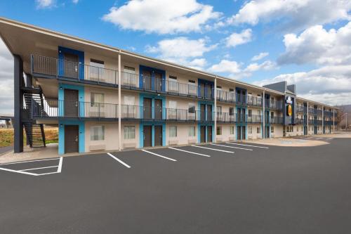 an empty parking lot in front of a building at Super 8 by Wyndham Charleston WV in Charleston