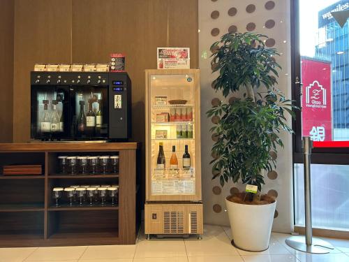 a refrigerator filled with lots of bottles of wine at Ginza International Hotel in Tokyo