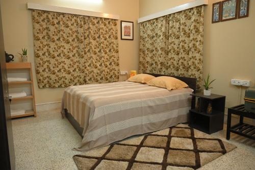 a bedroom with a bed in a room at Studio 61 Saltlake Sector 1 Kolkata in kolkata