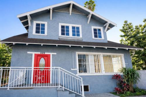 a blue house with a red door at Vernon Homes For The Soul in Los Angeles