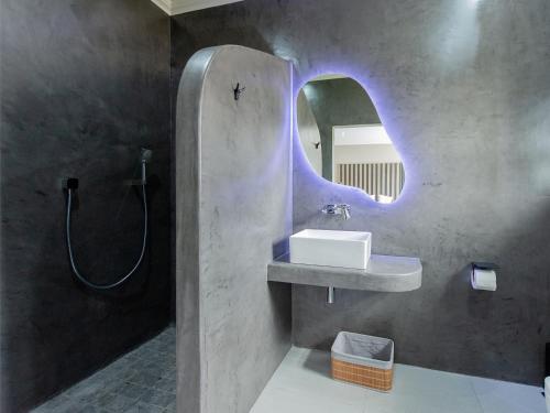 a bathroom with a sink and a mirror at Grey Luxury Accommodation Langebaan in Langebaan