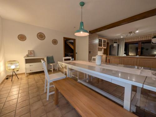 a large kitchen with a large table and chairs at Heidezimmer in Bispingen