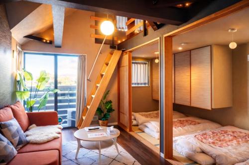 a bedroom with a bunk bed and a stairway at Life House Tamatsukuri Osaka Castle in Osaka