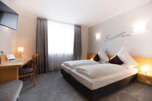 Letto o letti in una camera di Drexel´s Parkhotel