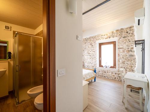 a bathroom with a toilet and a sink and a shower at La Piazzetta in Goito