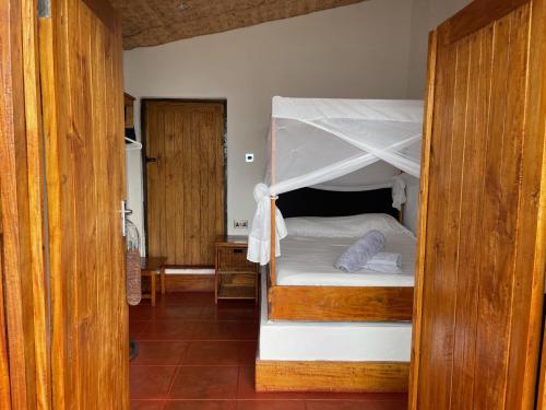 Llit o llits en una habitació de njaya lodge