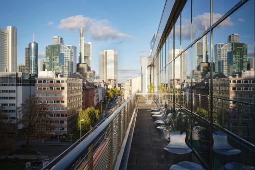 a view of a city skyline from a building at Roomers Frankfurt Central, Autograph Collection in Frankfurt