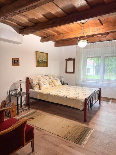 a bedroom with a large bed in a room at Sziget Vendégház Parád in Parád