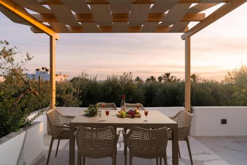 a table and chairs on a patio with a view at Alea Villa in Ierapetra