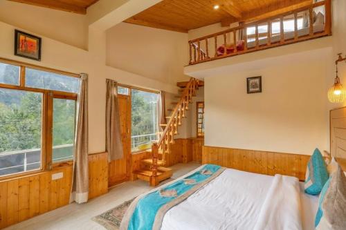 a bedroom with a bunk bed and a ladder at Purnima Little Italy in Manāli