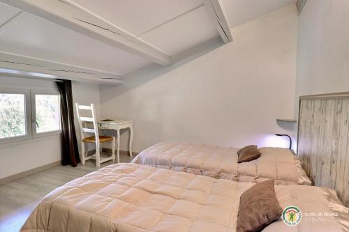 Llit o llits en una habitació de mondonlehaut
