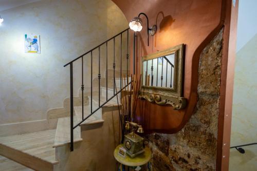 a spiral staircase in a home with a window at Tri Re e 'na Regina in Cinisi