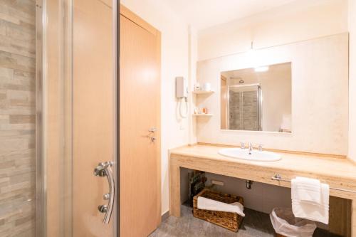 a bathroom with a sink and a shower at Approdo Boutique Hotel Leuca in Leuca