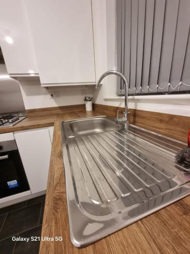 a kitchen sink with a faucet on top of it at Beluca homes Acklam in Middlesbrough