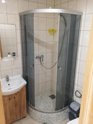 a bathroom with a shower and a sink at Wellness rezort Maxim Bojnice in Bojnice