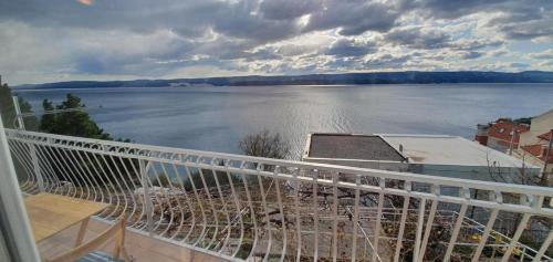a balcony with a view of a large body of water at 205 Mata, 80m vom Strand in Stanići