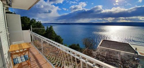 a balcony with a view of a large body of water at 205 Mata, 80m vom Strand in Stanići