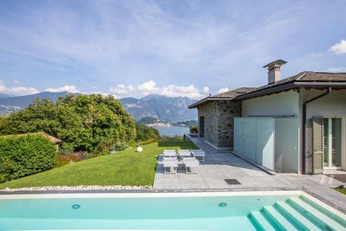 a villa with a swimming pool and a house at Villa Miraggio by MyVillaCollection in Tremezzo