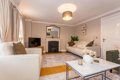 a living room with a couch and a table at Kirkwood Drive in Durham