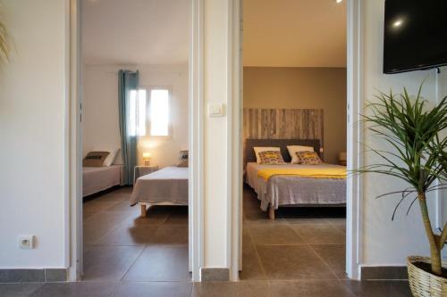 a bedroom with a bed and a room with a bed at Casa di Sole in Sotta