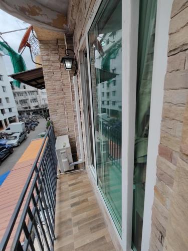 a balcony with a view of a street at Am Am Place แอม แอม เพลส in Bangkok