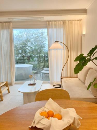 a room with a bed and a bathroom with a tub at Jeju Byeolkkum Pension in Jeju