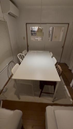 a white table and chairs in a room at 世田谷区経堂の小さな一棟貸wakusei in Tokyo