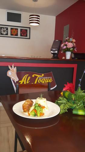 a plate of food on a table in a restaurant at Veranda Hotel in San Pedro Sula