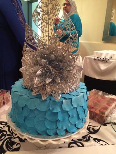 a blue cake is sitting on a table at The Cradle Berry Farm in Muldersdrift